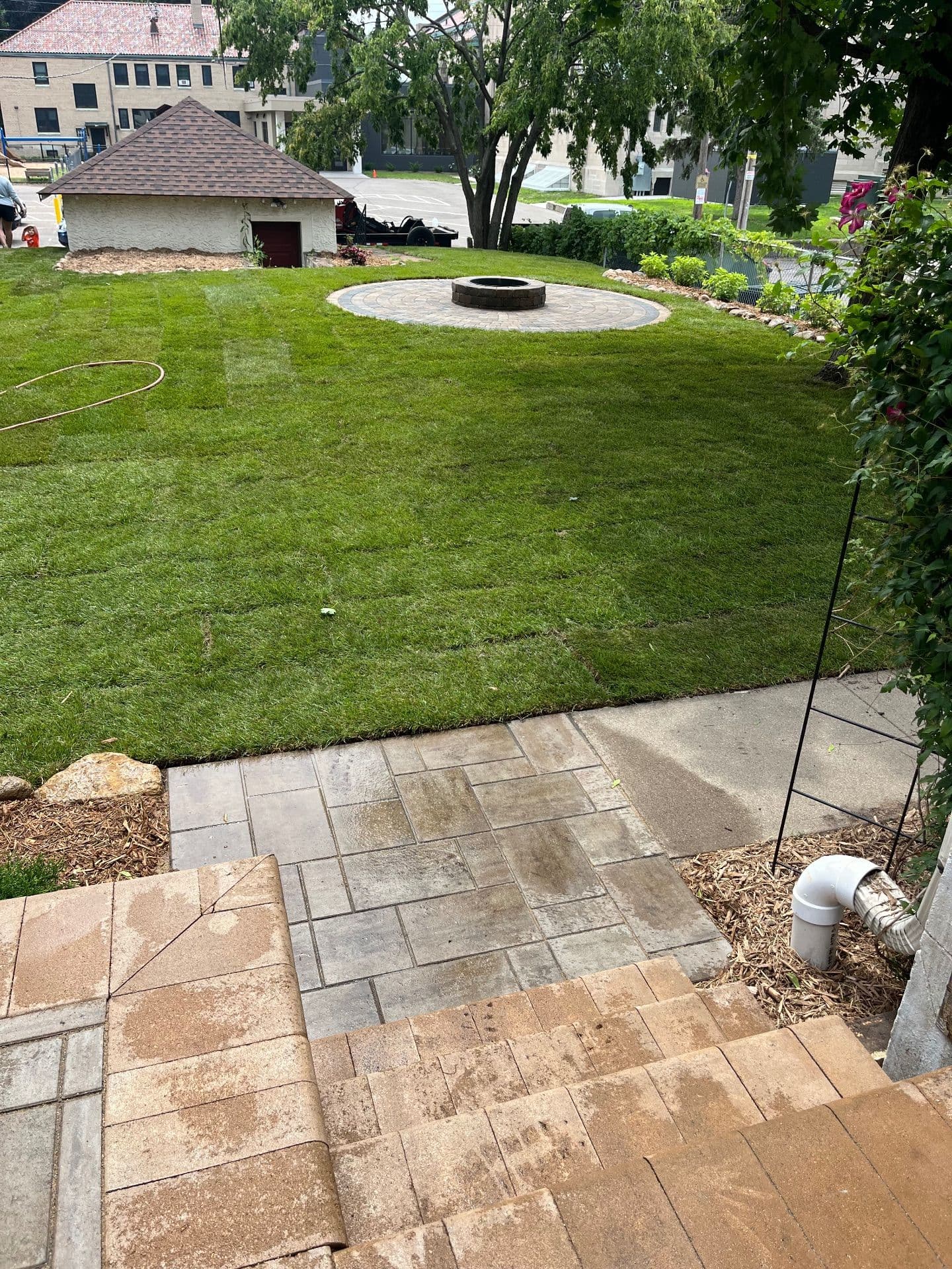 Backyard Transformation with Fire Pit and Lush Landscaping image