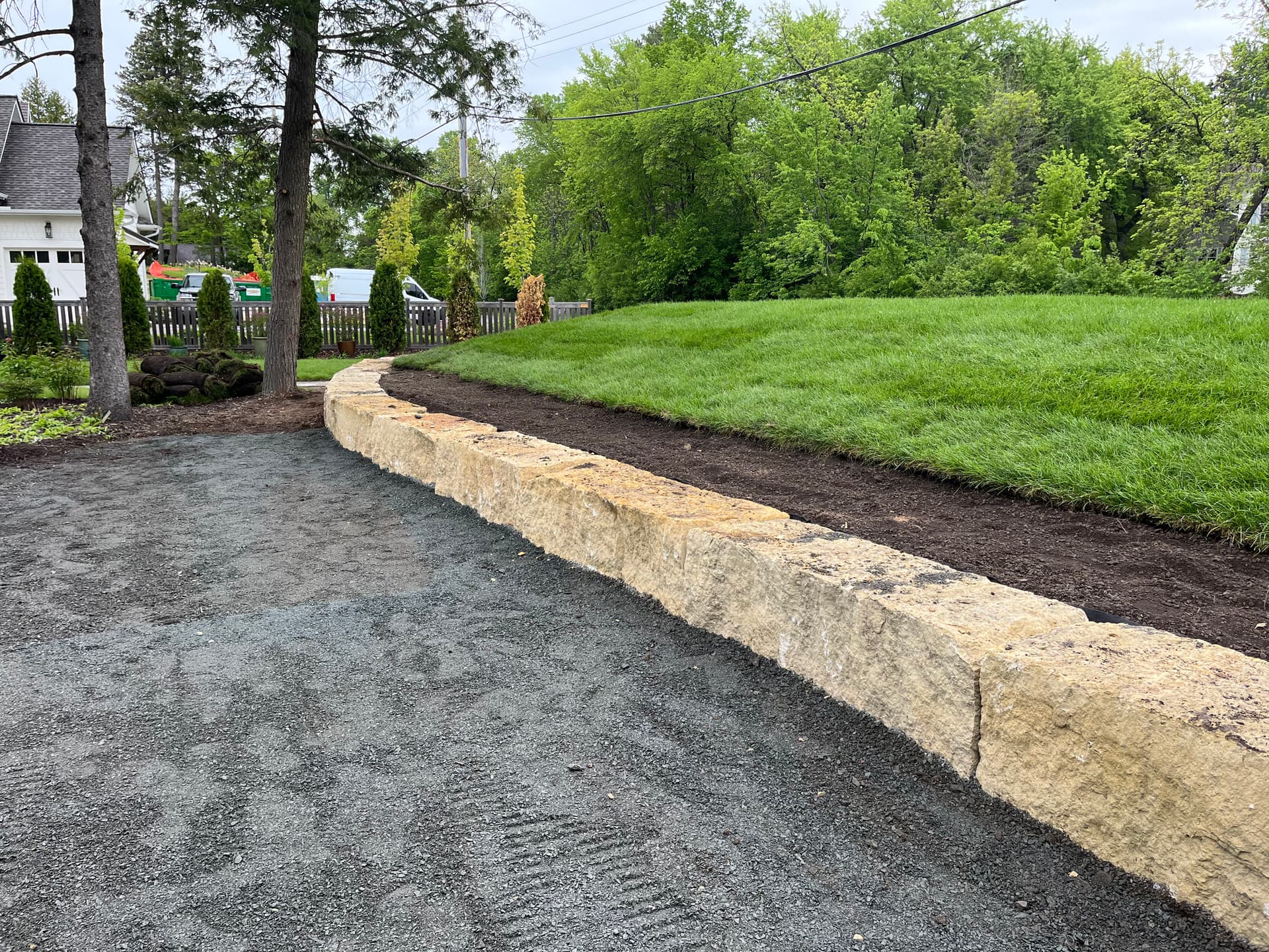 Limestone Boulder Retaining Wall Frames a Septic Mound in Dellwood
