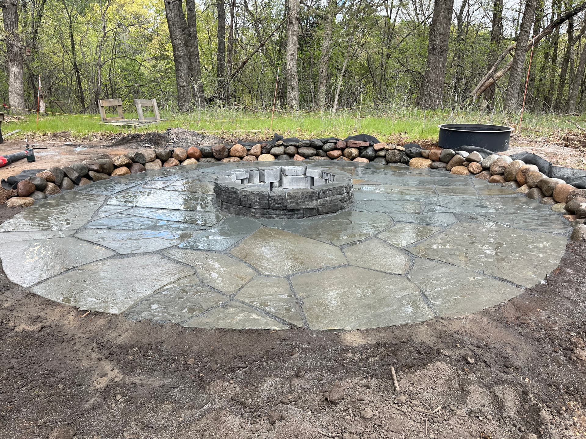 Boulder Walls, Flagstone Patio and Fire Pit Build in Afton image