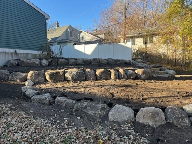 Boulder Walls and Steps Create Stunning Yard in St. Paul image